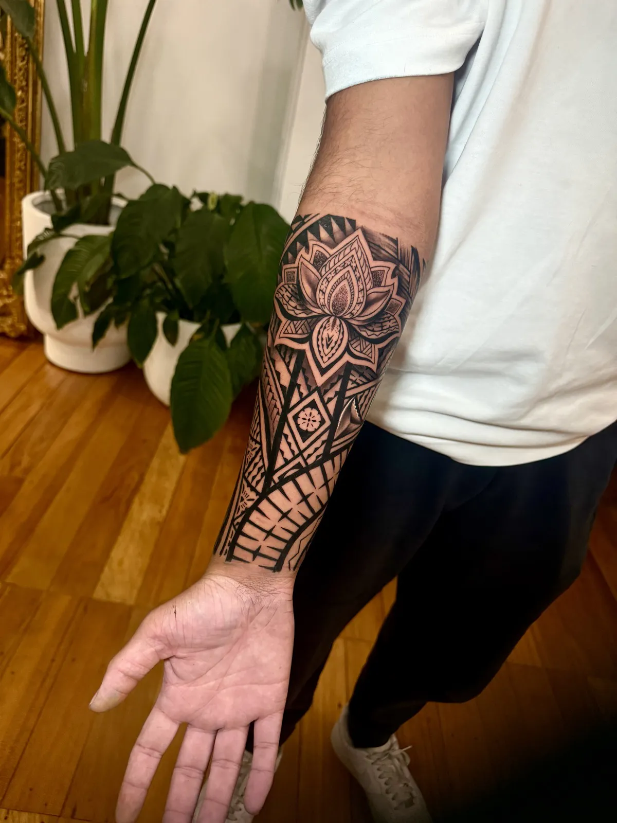 Detailed custom Polynesian forearm tattoo in progress on a client's arm at Memento Tattoo in Newtown, Sydney