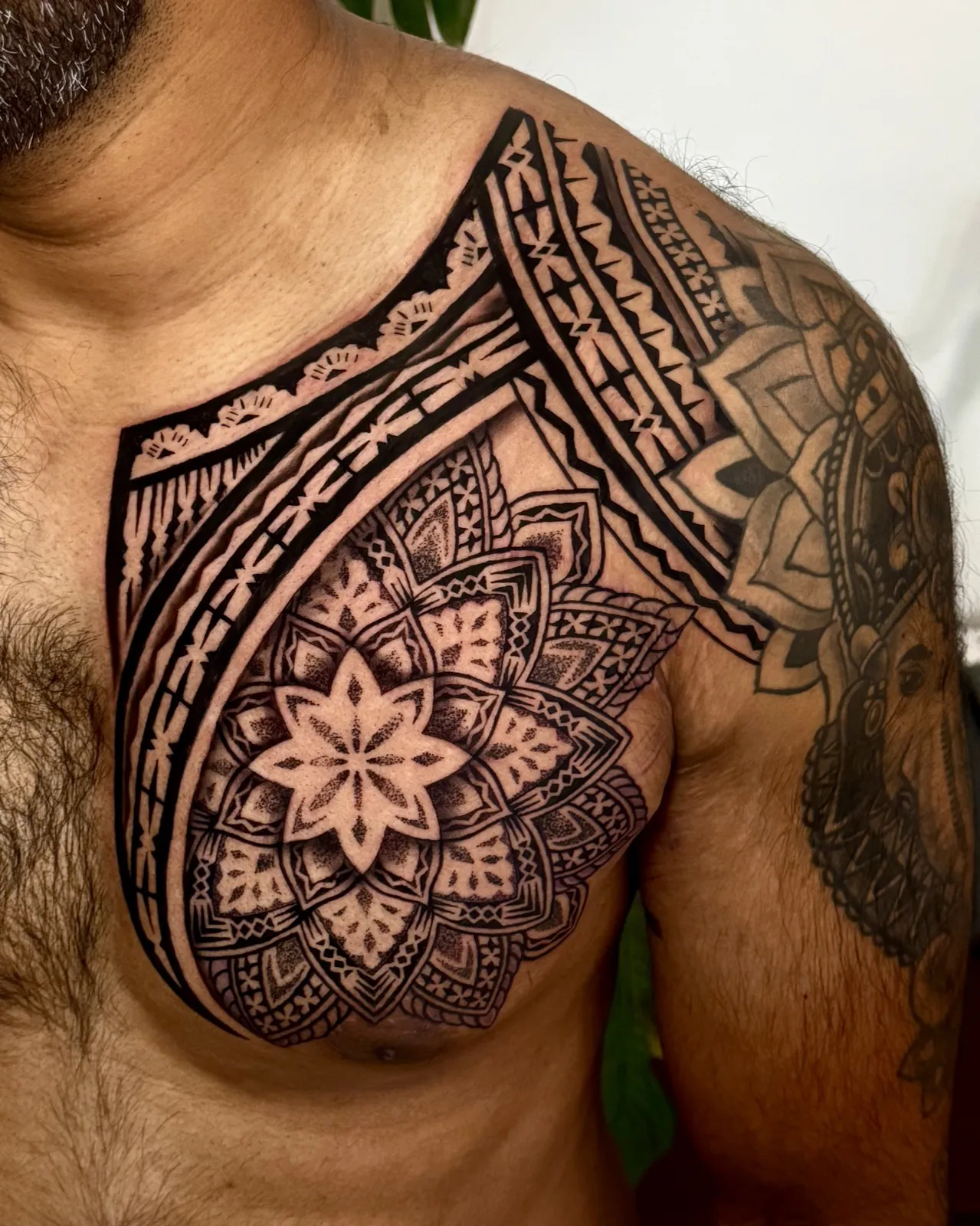 Fijian and mandala chest piece tattooed by Ameo Bolaira