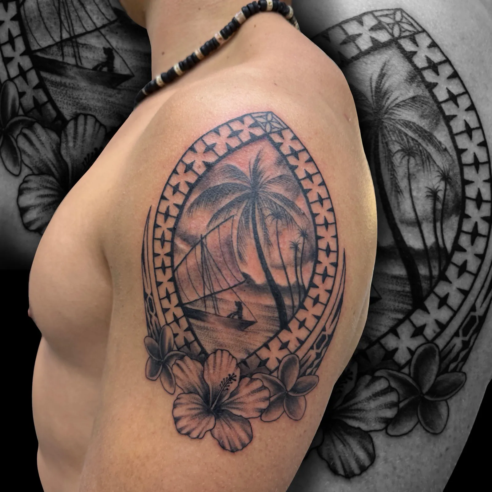 Polynesian shoulder and upper-arm tattoo with an outrigger canoe, palm and frangipani inside traditional banding