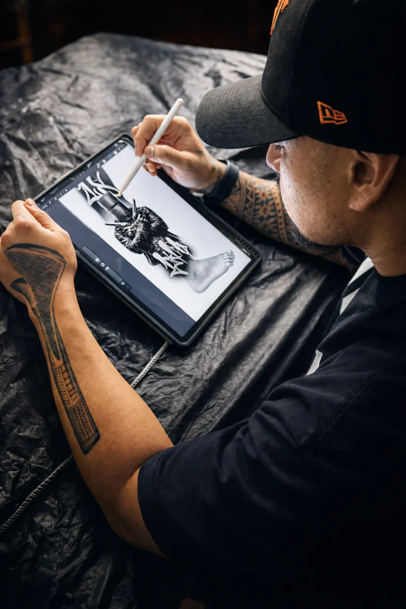 Amz drawing a custom tattoo design on an iPad
