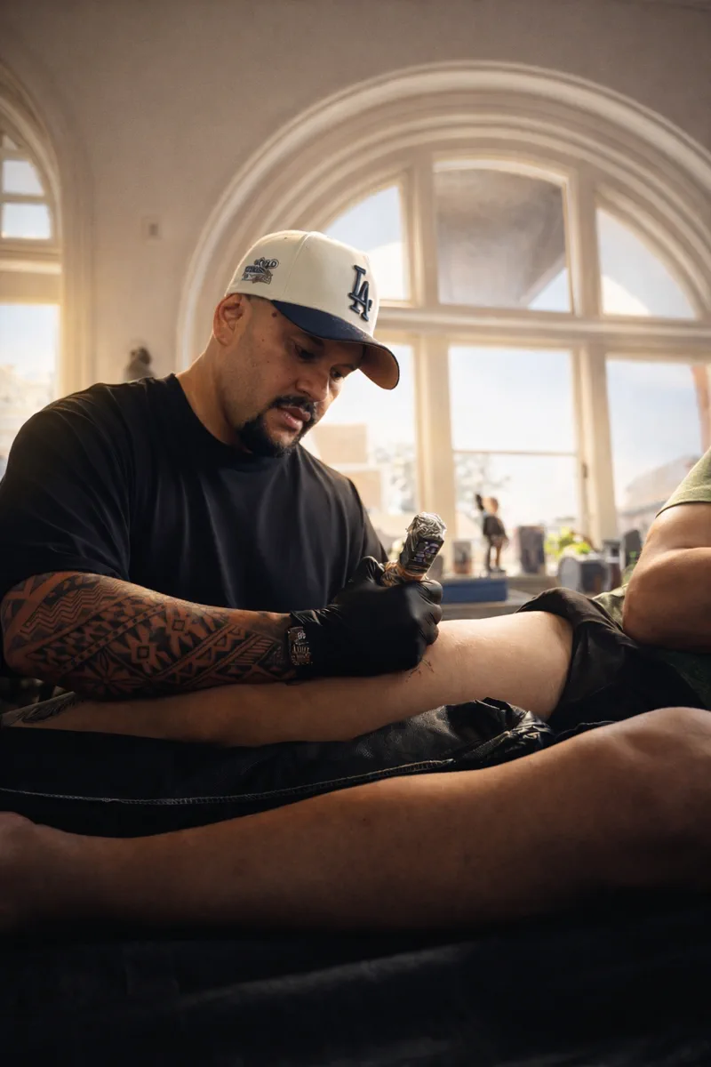 A tattoo in progress in calm, warm natural light